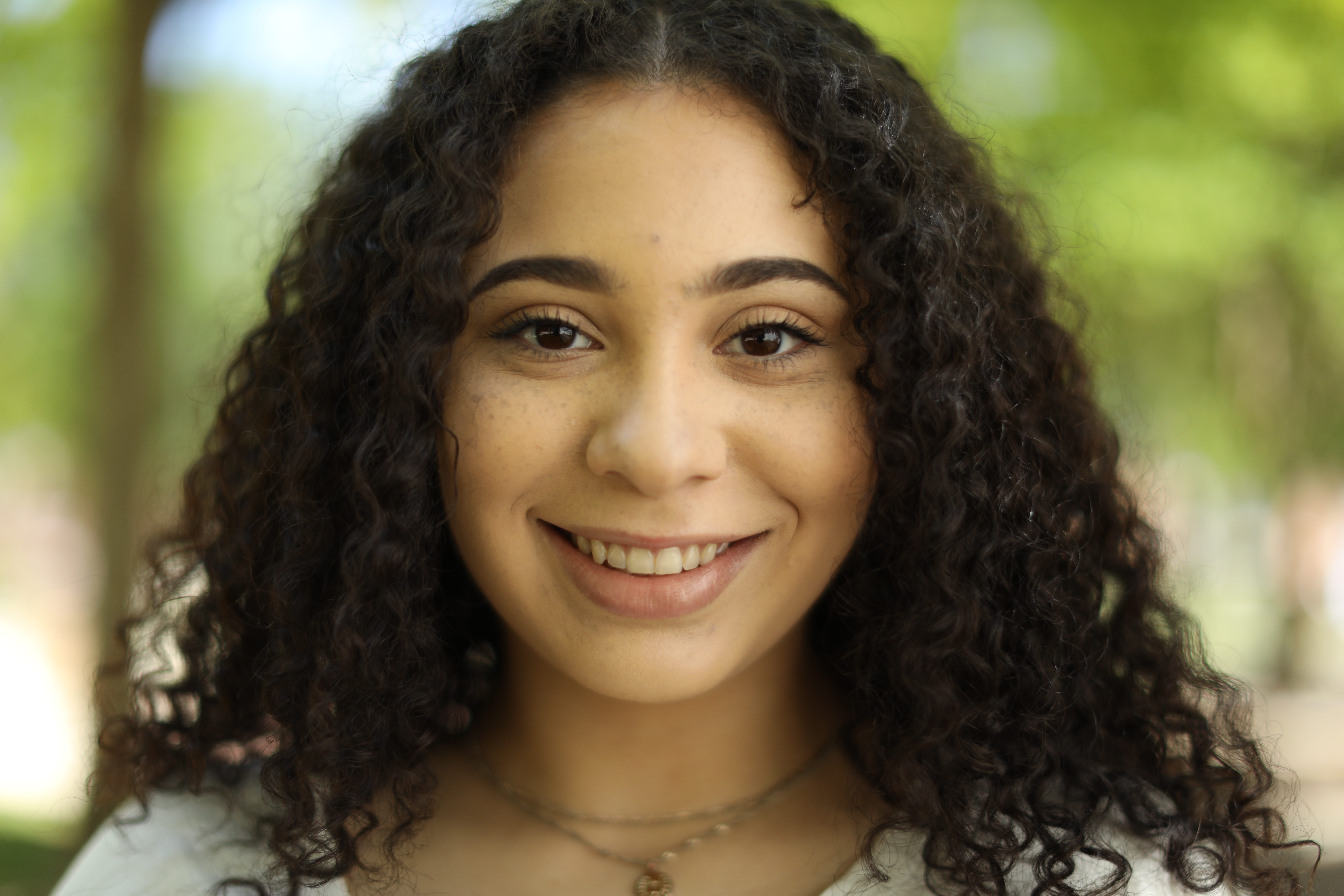 female student smiles at the camera