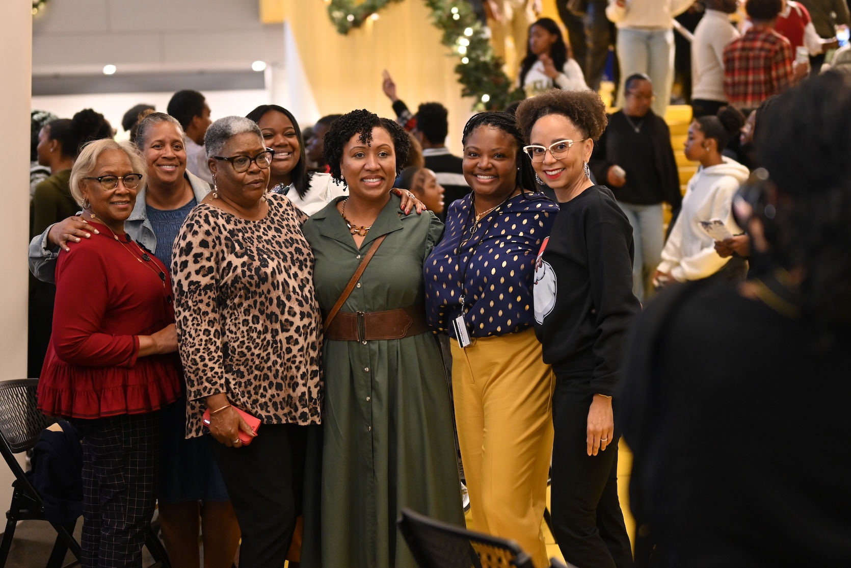 Group of Black women smiling at Holiday Tree Lighting