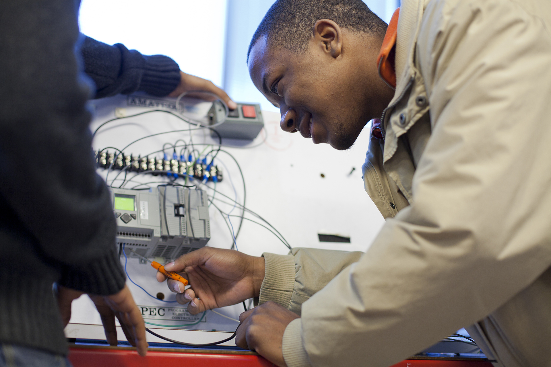 black male analyzing machine